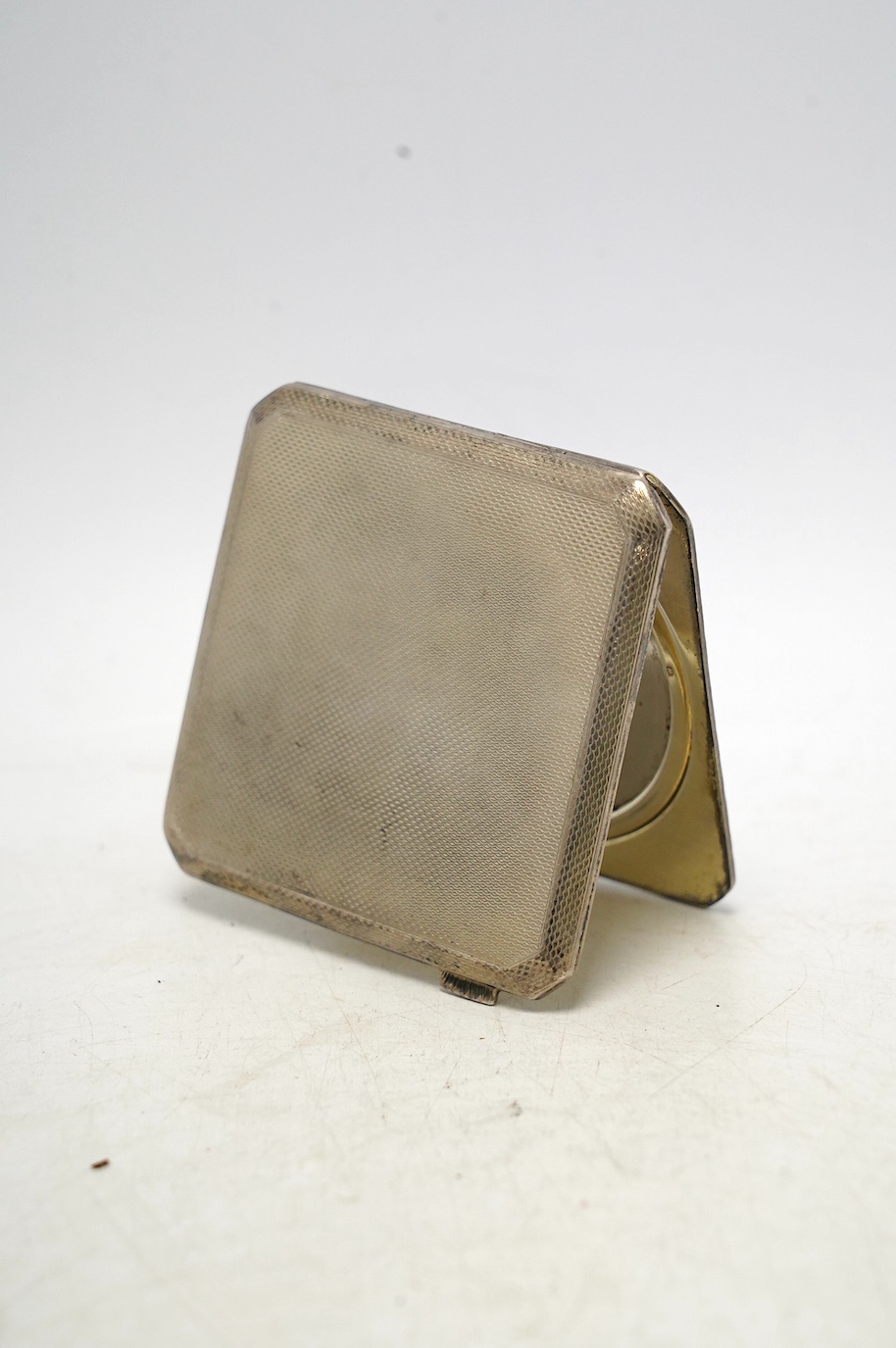 A George V silver and blue guilloche enamel compact by Asprey & Co, Birmingham, 1933, 72mm. Condition - poor
